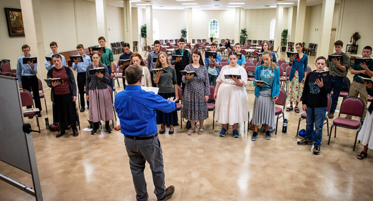 High school choir students practicing their pieces in the Shrine.