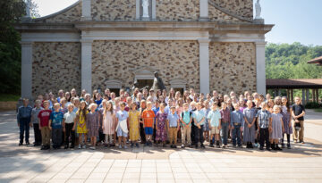 A group photo of young children in front of the Shrine Church in La Crosse, Wisconsin.