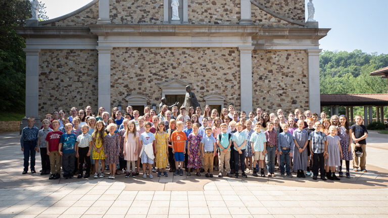 A group photo of young children in front of the Shrine Church in La Crosse, Wisconsin.