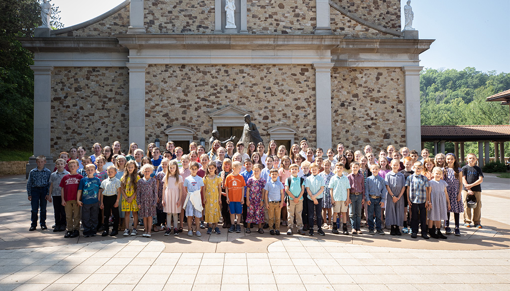 A group photo of young children in front of the Shrine Church in La Crosse, Wisconsin.