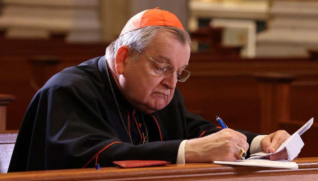 Raymond Leo Cardinal Burke signing the Dubia Submitted to Pope Francis in the church of Our Lady of Guadalupe Shrine in La Crosse, Wisconsin.