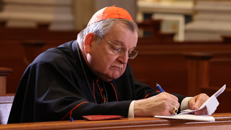 Raymond Leo Cardinal Burke signing the Dubia Submitted to Pope Francis in the church of Our Lady of Guadalupe Shrine in La Crosse, Wisconsin.