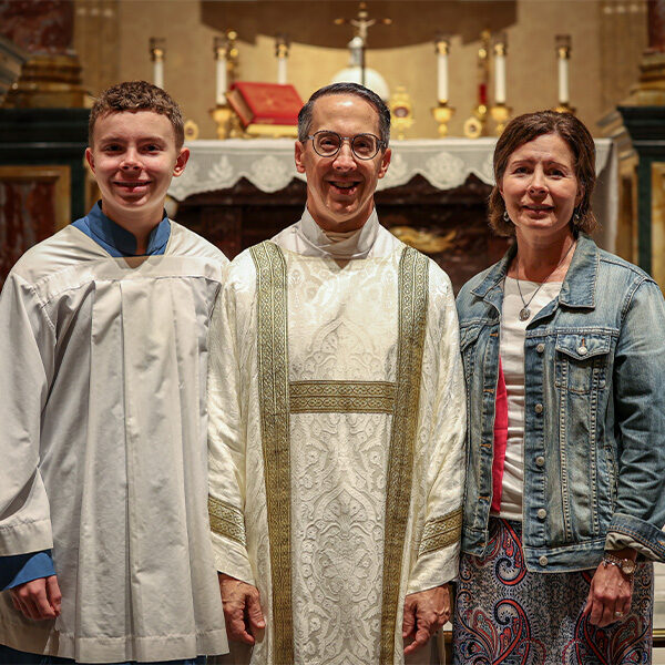 A closeup of the Deacon Kabat with wife and son in the Shrine Church located in La Crosse, Wisconsin.