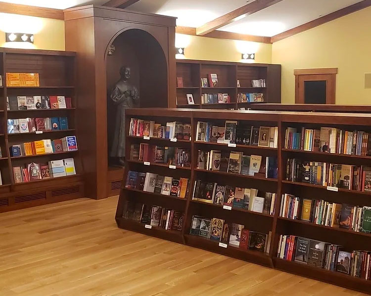 Books lined on the shelves of the Flores Mariae Gift shop at Our Lady of Guadalupe Shrine in La Crosse, Wisconsin.