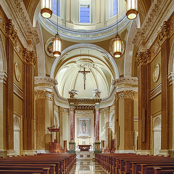 Empty pews leading to the altar in the church of Our Lady of Guadalupe Shrine in La Crosse, Wisconsin.