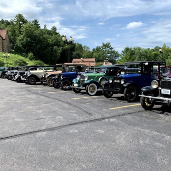 Classic cars parked in the parking lot of Our Lady of Guadalupe Shrine in La Crosse, Wisconsin.