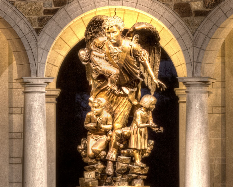 Statue depicting an angel carrying children to heaven at Our Lady of Guadalupe Shrine in La Crosse, Wisconsin.