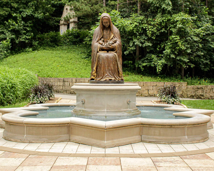 Fountain and statue of Lady Guadalupe holding three babies at the Memorial to the Unborn at Our Lady of Guadalupe Shrine in La Crosse, Wisconsin.