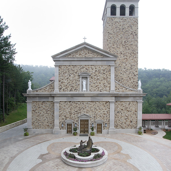 The courtyard of Our Lady of Guadalupe Shrine in La Crosse, Wisconsin with the statue of Juan Diego in the center.