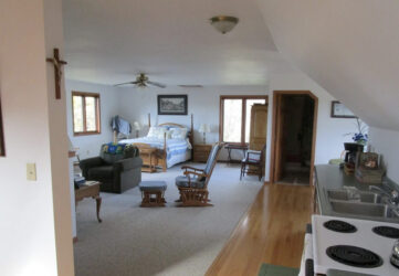 Bedroom and living room area at St. Joseph's Farm, Holy Angels Guest House in Westby, Wisconsin.