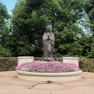 Statue of Mary praying in the garden at Our Lady of Guadalupe Shrine in La Crosse, Wisconsin.