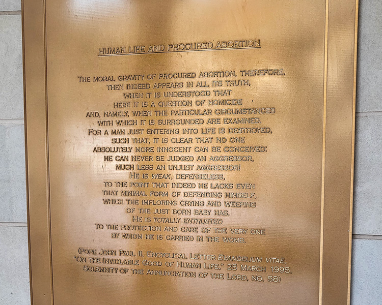 Plaque depicting The Catholic Church Teaching of Human Life and Procured Abortion located in the Memorial to the Unborn at The Shrine of Our Lady of Guadalupe in La Crosse, Wisconsin.