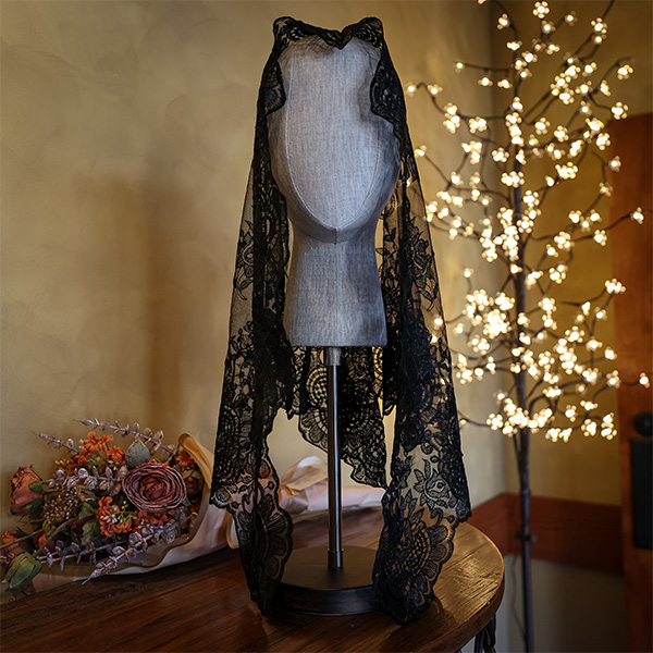 A black lacy floral veil in the Shrine giftshop.