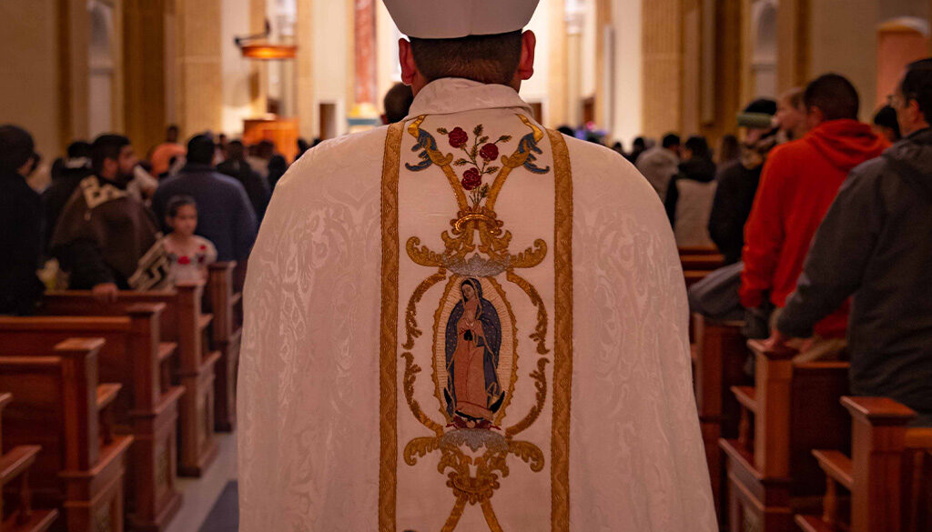 A Norbertine Priest walking down the Shrine church isle for Mass Prayer.