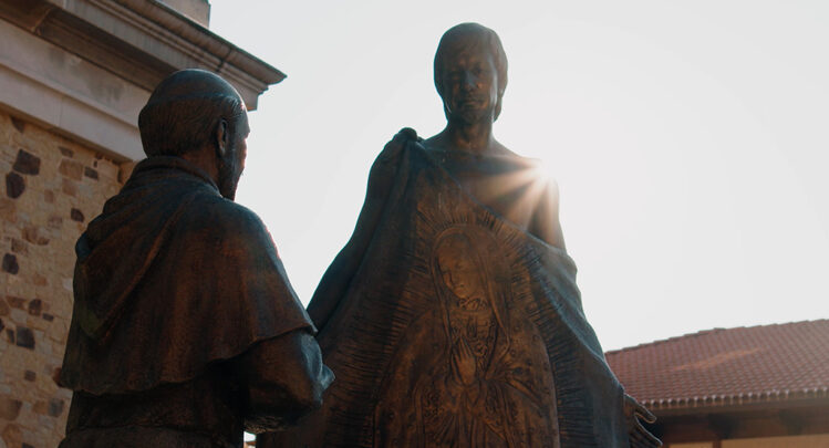 A plaza statue of St. Juan Diego presenting Tilma to the bishop.