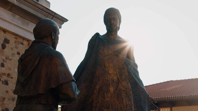 A plaza statue of St. Juan Diego presenting Tilma to the bishop.