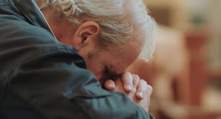 A man praying at the Shrine of Our Lady of Guadalupe in La Crosse, WI