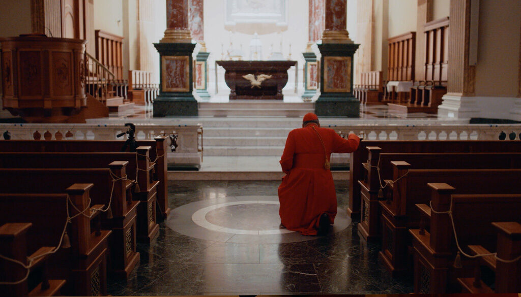 Cardinal Burke founder of the Shrine of Our Lady of Guadalupe in La Crosse, WI kneeling before the Tabernacle