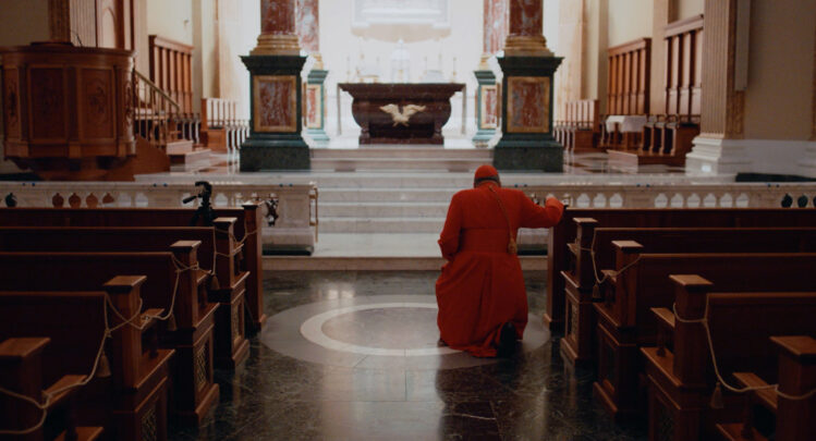 Cardinal Burke founder of the Shrine of Our Lady of Guadalupe in La Crosse, WI kneeling before the Tabernacle