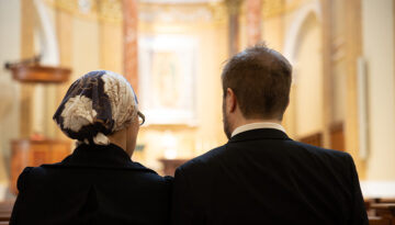 Married Couple Praying together at The Shrine of Our Lady of Guadalupe