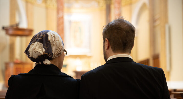 Married Couple Praying together at The Shrine of Our Lady of Guadalupe