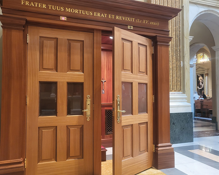 Shrine Confessional behind a screen with kneelers