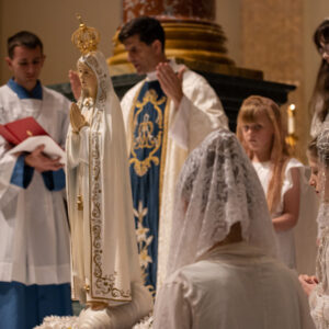 Priest blessing Blessed Our Lady of Fatima Statue