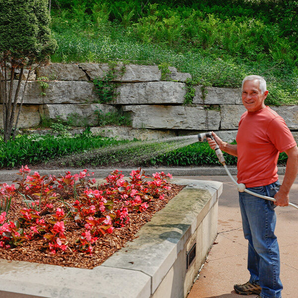 Flowers being watered at The Shrine of Our Lady of Guadalupe