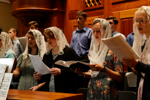 Chant Camp students singing for Mass in the Guadalulpe Shrine choir loft