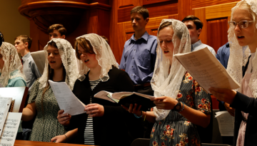 Chant Camp students singing for Mass in the Guadalulpe Shrine choir loft