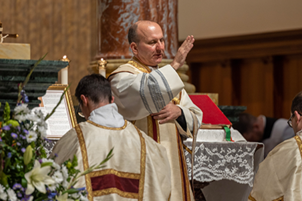 Fr. Check priest blessing in a Catholic church