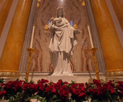 Marble Statue of the Immaculate Heart decorated with roses