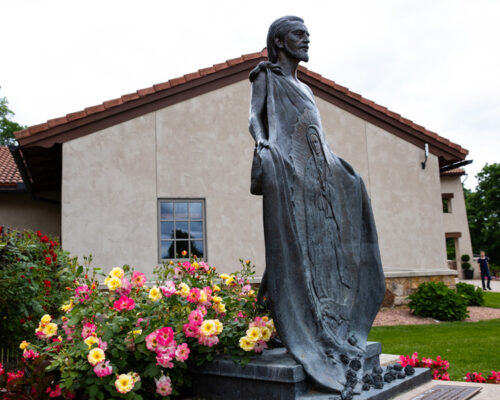 St. Juan Diego Statue with flowers