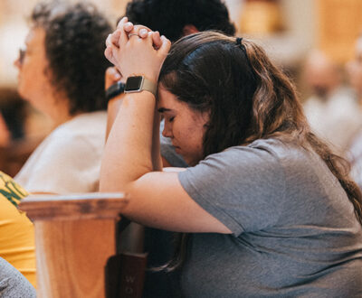 Woman praying at the Guadalupe Shrine