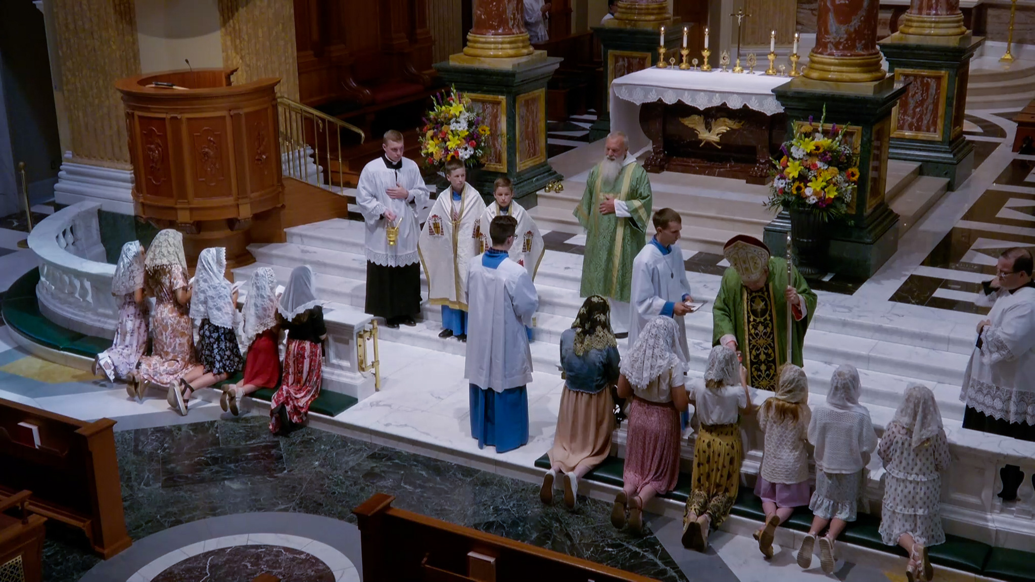 Cardinal Burke handing out Handmaidens prayers