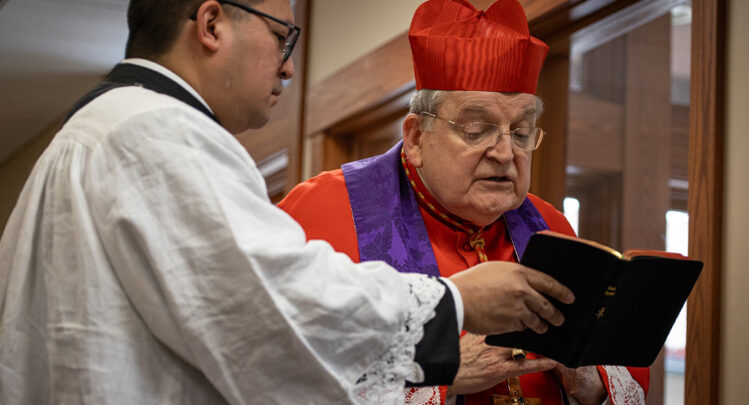 Cardinal Burke praying prayers of exorcism before blessing the Shrine grounds