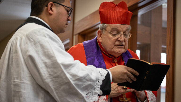 Cardinal Burke praying prayers of exorcism before blessing the Shrine grounds
