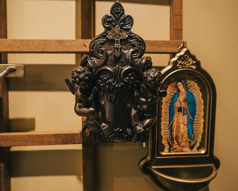 Holy water fonts at the Flores Mariae Gift Shop Our Lady and bronze angels