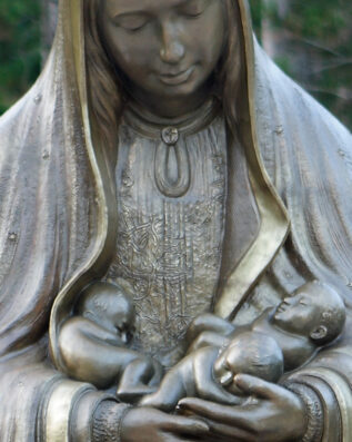 Mary Statue holding God's children in her arms memorial to the Unborn