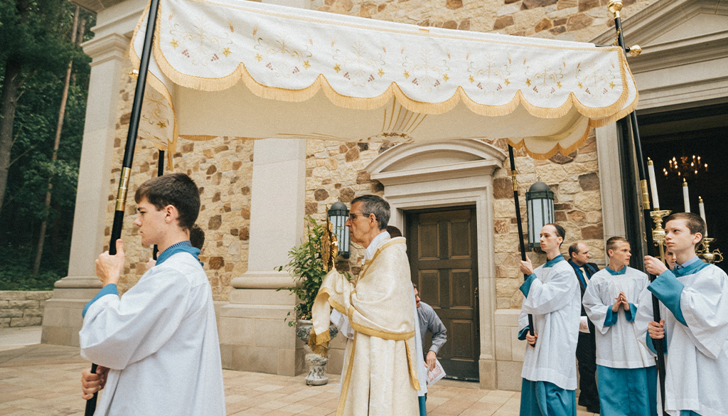 Father Hildebrand Leading the Corpus Christi Procession summer 2024