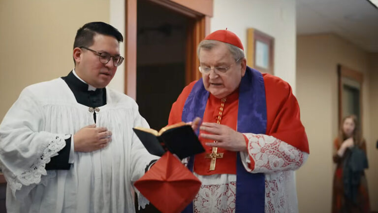 Cardinal Burke performing a minor exorcism at the Shrine of Our Lady of Guadalupe in La Crosse, Wisconsin, on August 20, 2024, alongside an assistant.