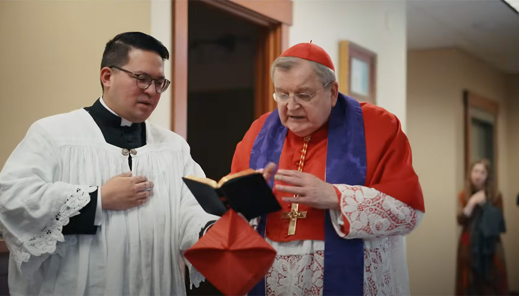 Cardinal Burke performing a minor exorcism at the Shrine of Our Lady of Guadalupe in La Crosse, Wisconsin, on August 20, 2024, alongside an assistant.