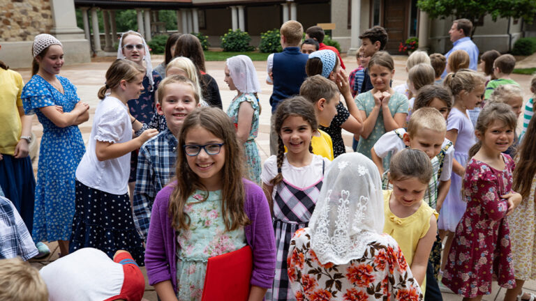 choir camp at the shrine of our lady of guadalupe children gathered with their folders