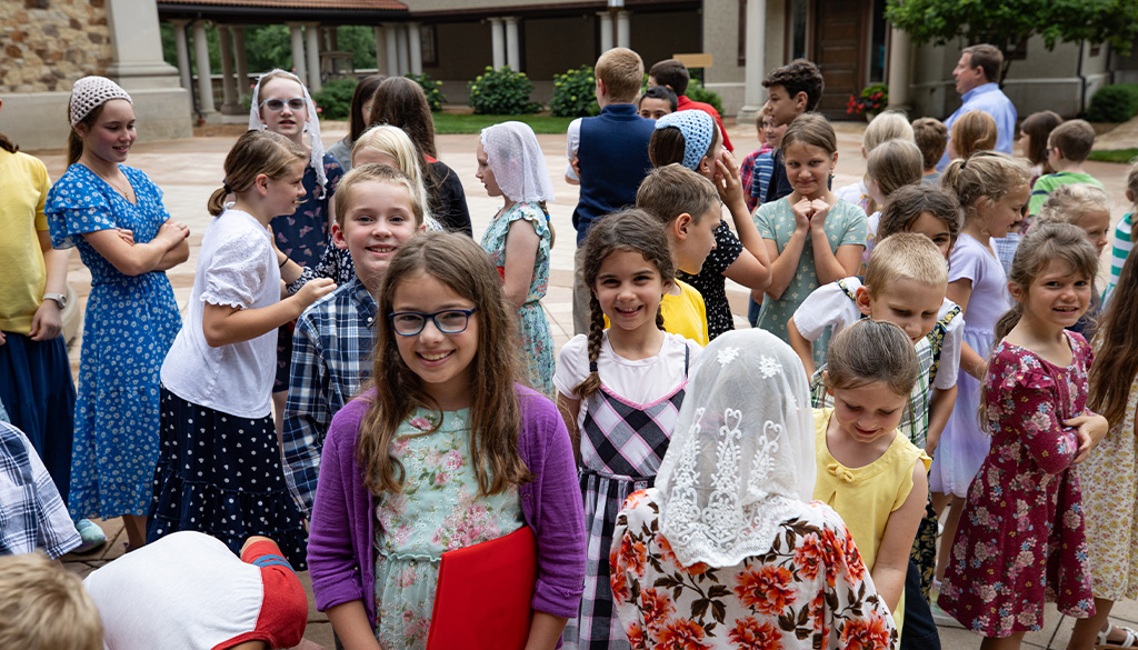 choir camp at the shrine of our lady of guadalupe children gathered with their folders